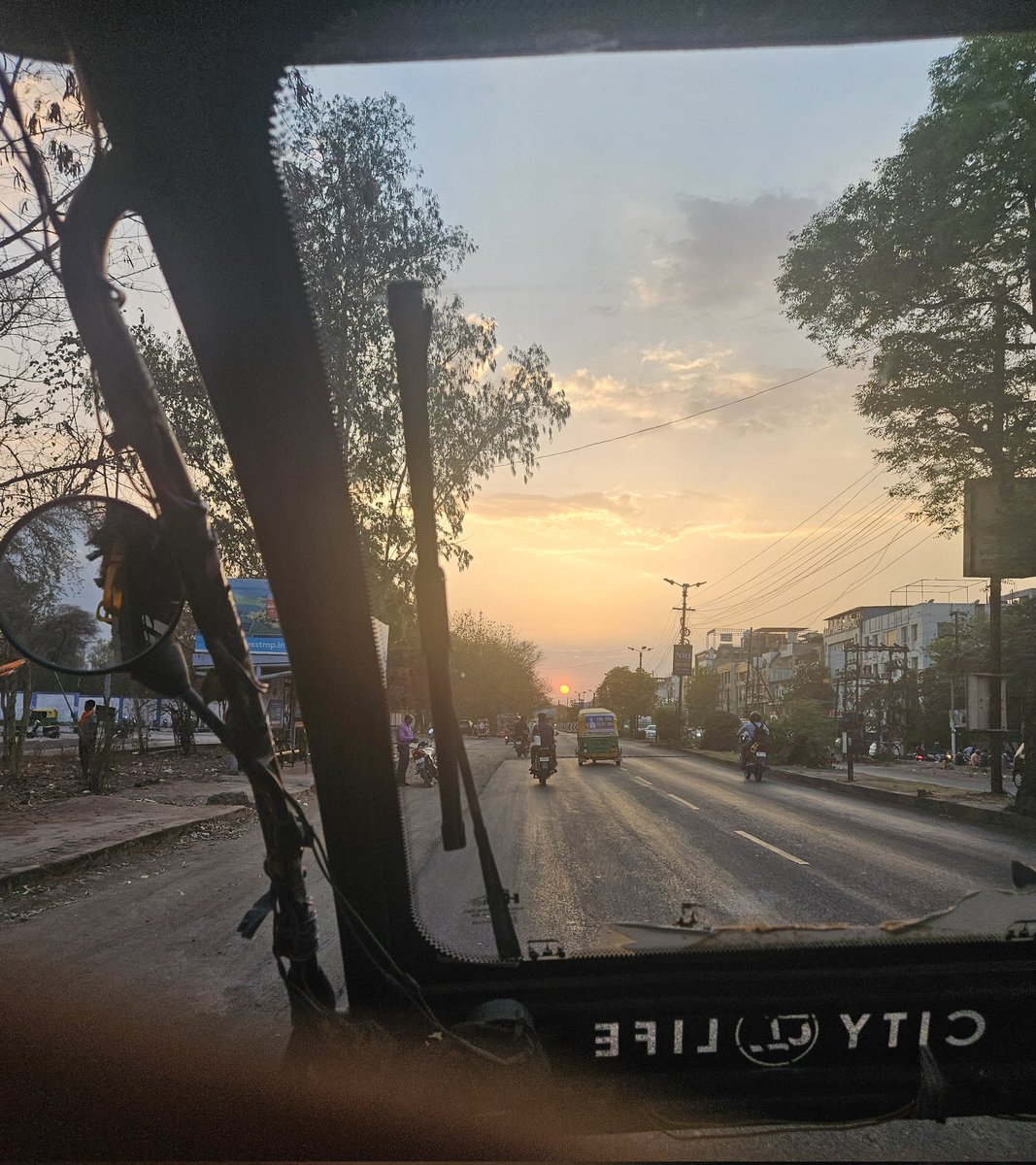 HitanshSharma25's tweet photo. On my way home, wrapped in sunset and street sounds https://t.co/75l5UvHDcD