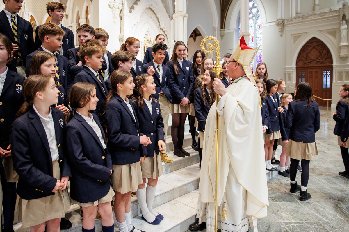Students with Archbishop Henning at this year's Chrism Mass. 

 #ChrismMass #ArchbishopHenning #YouthInFaith #CatholicStudents #FaithCommunity #ReligiousCeremony #ChurchLife #SpiritualGathering #CatholicYouth #FaithInAction