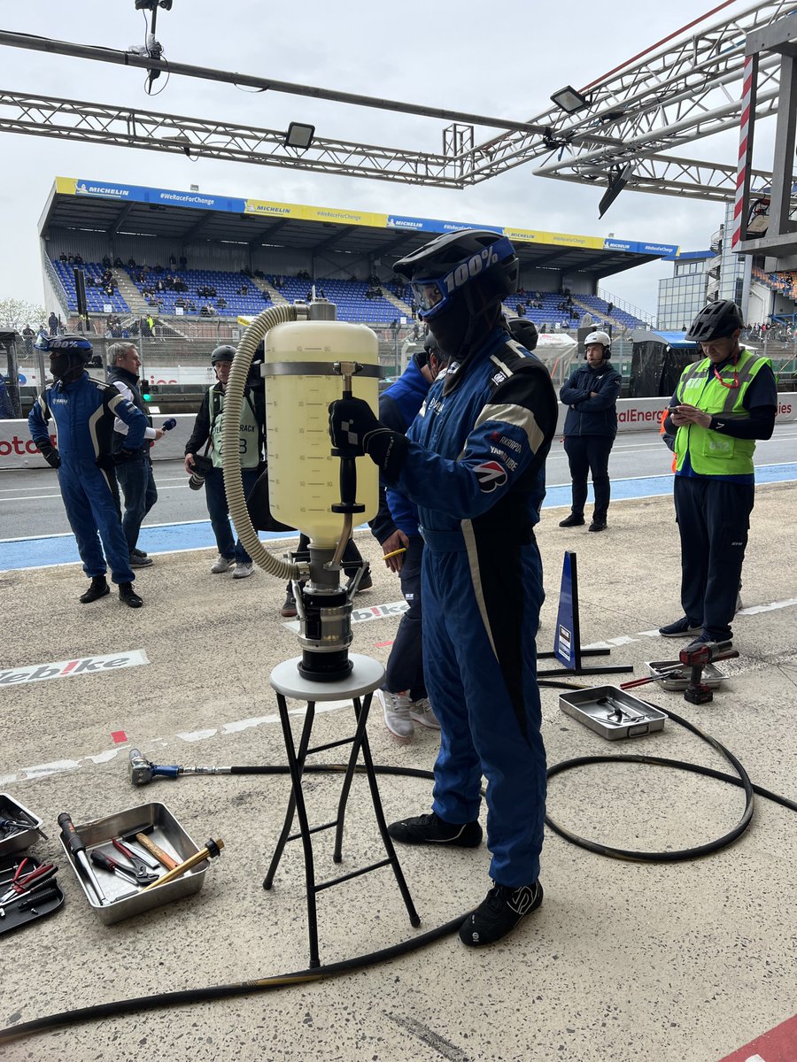 yamaharacingcom's tweet photo. You may be wondering why the fuel technician is balancing the fuel refiller on a bar stool...that's because it is rather heavy!

The refiller, which weighs 10kg alone, holds 27 litres of fuel, so can you guess how much it weighs in total?

#YamahaRacing | #FIMEWC | #24hMotos https://t.co/9PrQAGwJhb