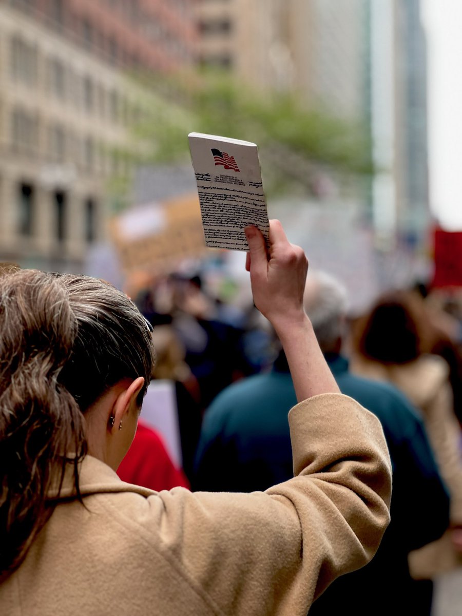 JennaSchmenna's tweet photo. Protesting in #Chicago today holding up my 12yo daughter’s pocket Constitution. https://t.co/gJ2e6mC1QX