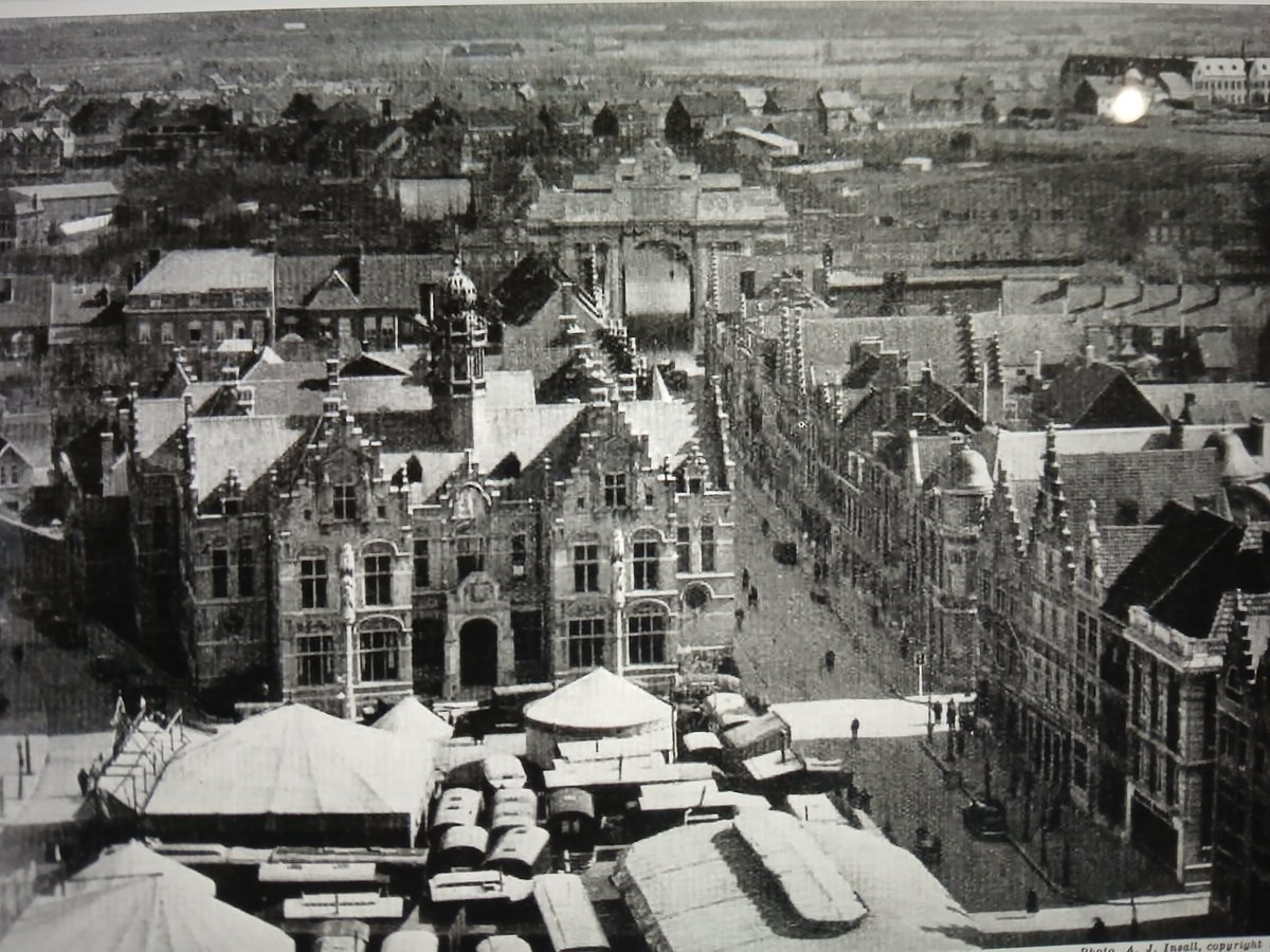 The rebuilt #ypres on a summer's day in the 1930s. Familiar landmarks can be seen and the deserted battlefield in the distance...#ww1