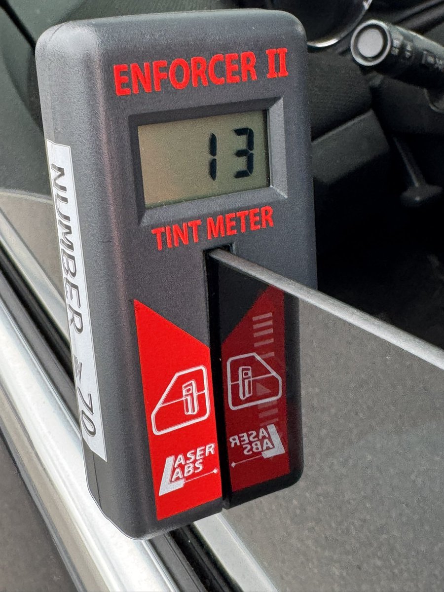 Another vehicle stopped today with front side windows having 87% tint, when 30% is the legal limit. This meter shows the opposite of tint, displaying VLT (Visual Light Transmission), so 100%-13%=87% tint. $110 fine + the cost or time to remove it