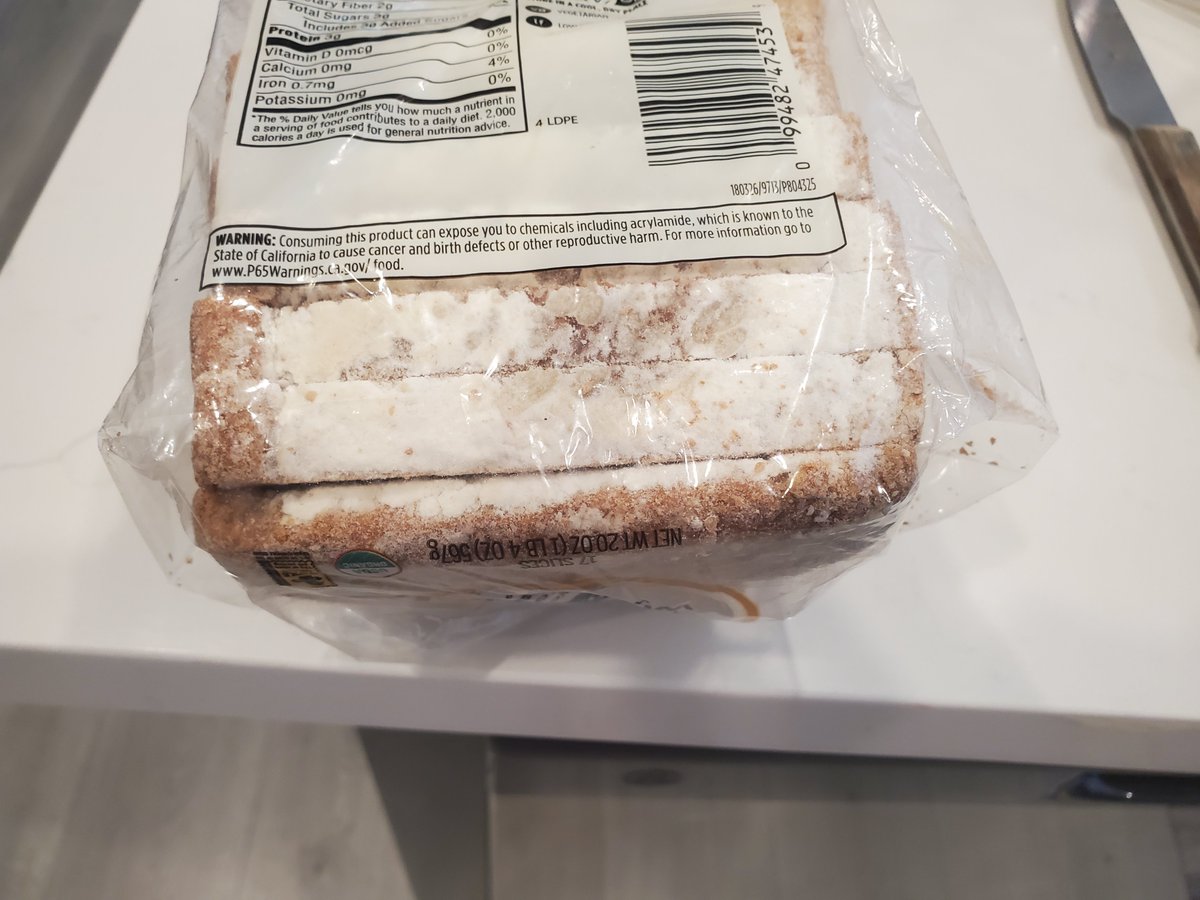 jerryeight's tweet photo. . Hi @WholeFoods is this normal? What is this white powder under the bread? Do you put flour under the bread? https://t.co/r5PaDvNDTi