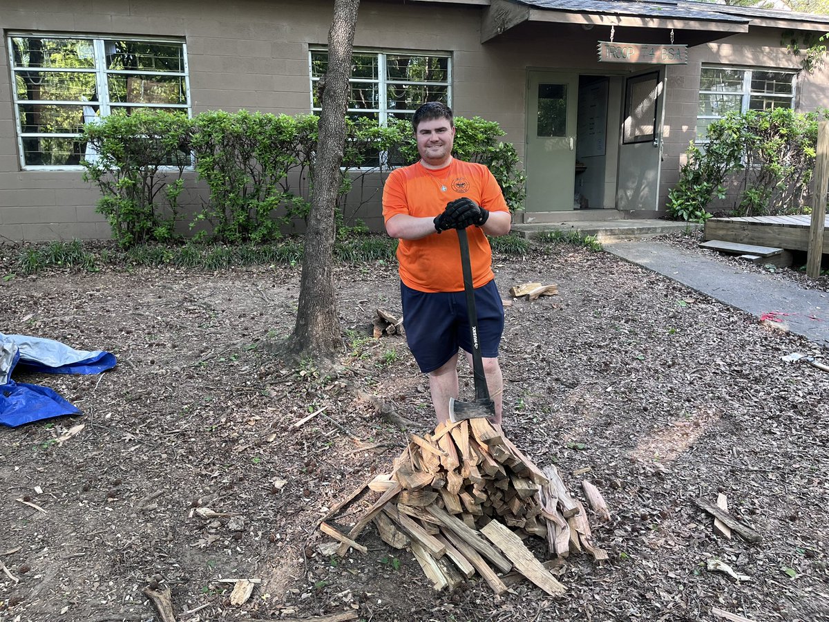 Our Scoutmaster and Asst Scoutmaster showing the Scouts how to chop some wood!