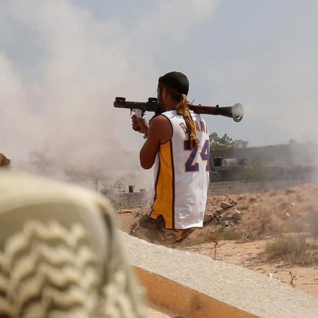 culturejpg's tweet photo. A libyan soldier fighting ISIS while dressed in a Kobe jersey https://t.co/3F15ZSV2Qw