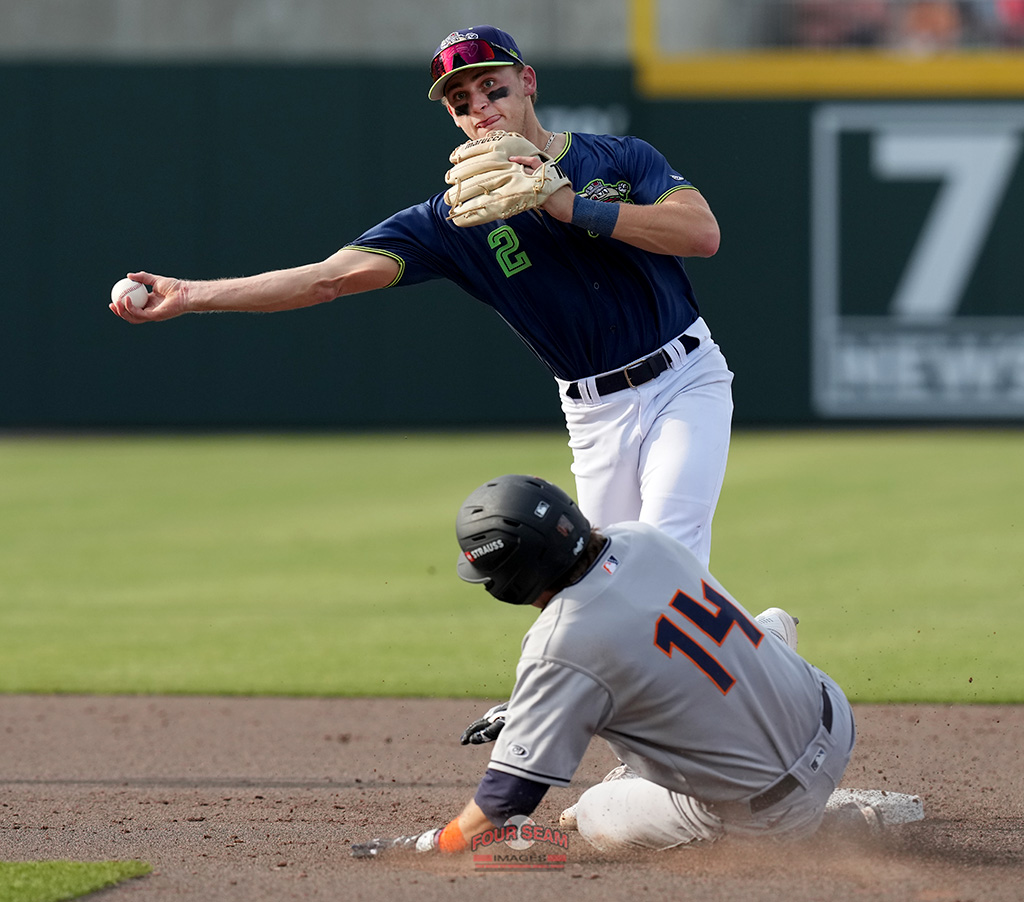 Hunter Haas (14) of the Bowling Green Hot Rods is out at second as second baseman Casey Cook (2) the Hub City Spartanburgers turns a double play in a South Atlantic League game on Saturday, April 19, 2025, at Fifth Third Park in Spartanburg, S.C. (Tom Priddy/Four Seam Images)