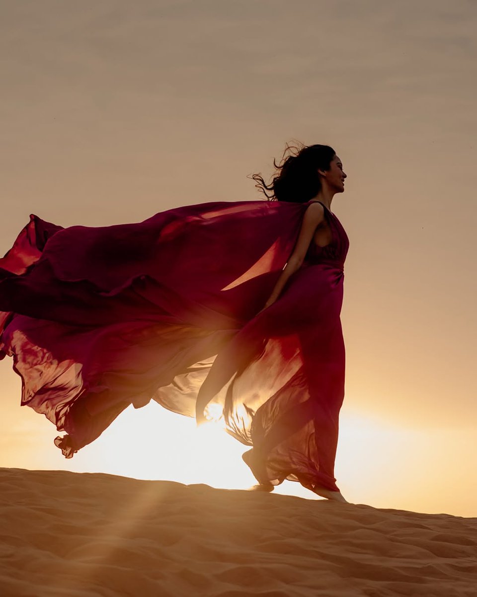 onepublicityph's tweet photo. There she stands, in the vastness of the desert, where the golden sands stretch endlessly, like time itself unraveling toward the horizon. The sun leans in to kiss her skin, warm and tender, like the embrace of another year. She is radiant—not because the world deems her so, but because she has learned to dance with the wind. To move with life, not against it.

She twirls barefoot on the dunes, grains of sand catching in the air, mimicking stars in broad daylight. Each step she takes echoes the rhythm of her heart—hopeful, grateful. 

Now, another year beckons, a promise etched in sky and sand. She greets it with arms wide open, heart unguarded, soul on fire. The desert, timeless and infinite, mirrors her hope—a hope that beauty will keep blooming in unexpected places. 

Life is indeed beautiful. So is she. 🩷

#KimChiu