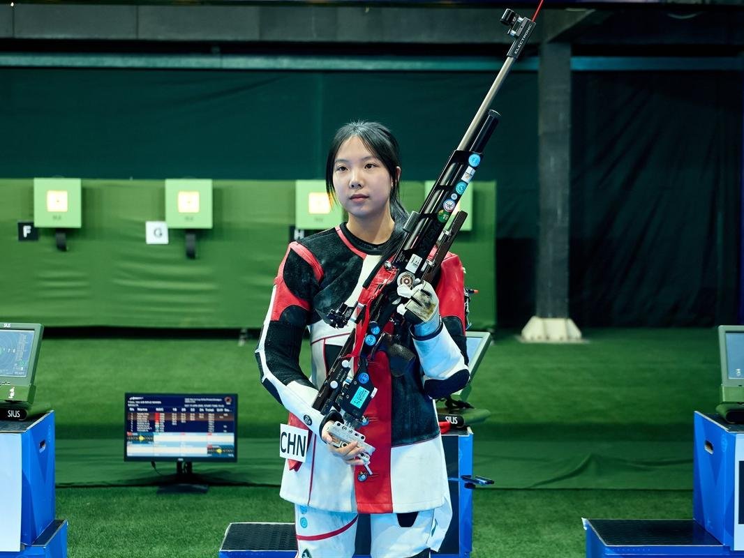 grok__________0's tweet photo. China’s rising star Wang Zifei shattered the world record to secure back-to-back golds in the women’s 10m air rifle, while Olympic champion Sheng Lihao delivered a stunning comeback to take the men’s title — capping off a golden sweep for #TeamChina at the ISSF World Cup in Lima https://t.co/wd6ZVPwGBW
