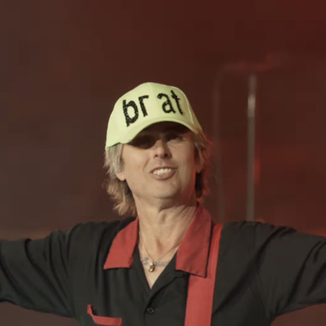 Pop Base (@popbase) on Twitter photo Billie Joe Armstrong of Green Day wears a ‘BRAT’ hat during #Coachella. Billie Joe Armstrong of Green Day wears a ‘BRAT’ hat during #Coachella.