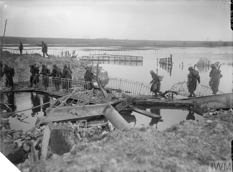 WW1IEPER1917's tweet photo. British troops are seen crossing the River Somme at Brie, near Peronne, 20th March 1917, following the withdrawal of German forces to strategic points on the Hindenburg Line.© IWM (Q 1828) https://t.co/bFhHIx9lrH