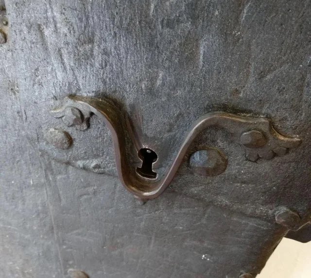 The antique door from 1380 in Regensburg, Germany - designed to make it easier for the homeowner to fit the key into the keyhole when returning home in the dark, or after having one beer too many.