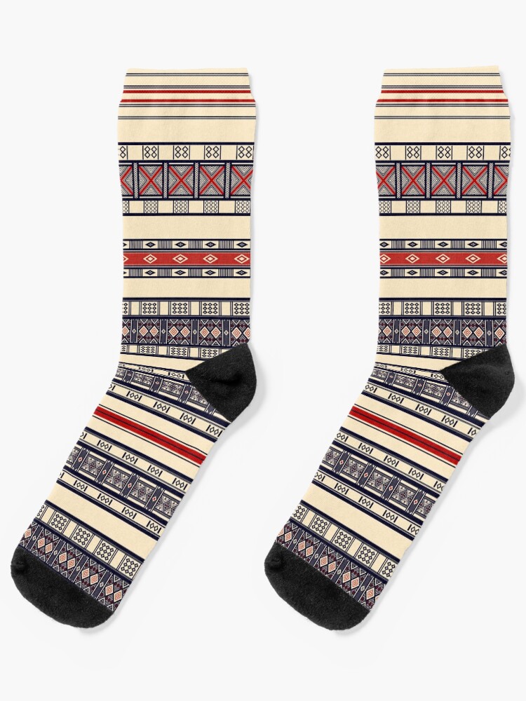 PDyaczenko's tweet image. Did you know the Fulbe people weave symbolic patterns into clothing to carry ancestral blessings? Step into tradition with these Traditional Fulbe Pattern: Wool Kaasa Design Socks. Get them at redbubble.com/i/socks/Tradit… #FulbeHeritage #KaasaDesign #PatternedSocks #CulturalWear
