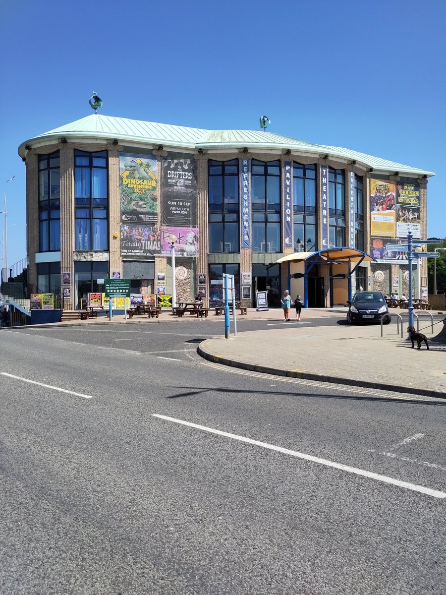 SeasideFerry's tweet photo. My book comes out a month today🥳 so it's high time I shared some of my favourite buildings from it. 
This is #Weymouth Pavilion, opened July 1960. Designed by Verity and Beverley it's in a sort of pebble-dashed mid-century seaside Georgian style with a bow front https://t.co/rEsQrojDBT