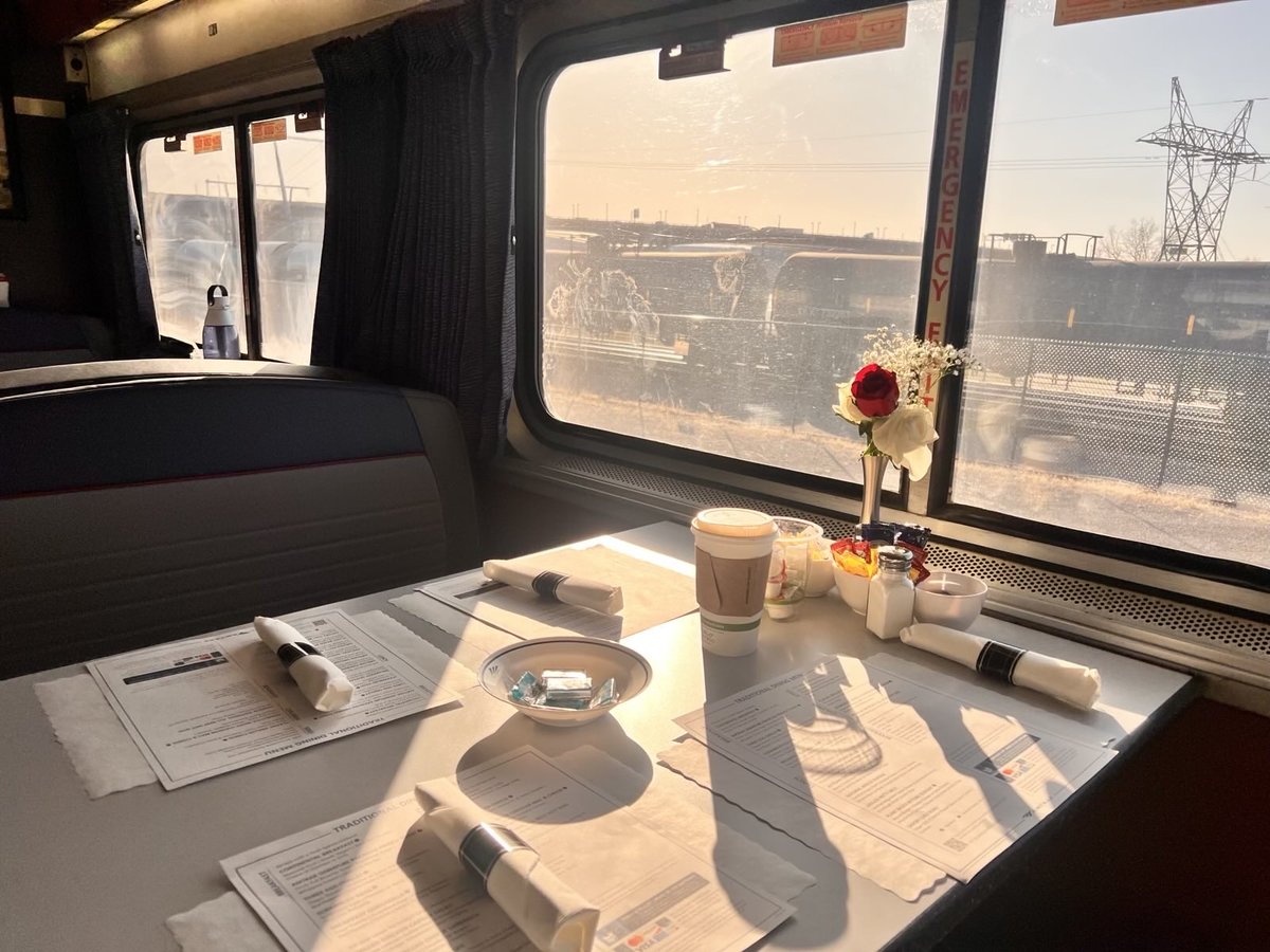 Took the train to Chicago.
Slower, yes. But something about it felt deeply honest.
No upgrades, no noise-canceling, no preboarding group wars.
Just my window to the world, a linen tablecloth, and a guy announcing smoke breaks like they were communion.
Of course I took part.