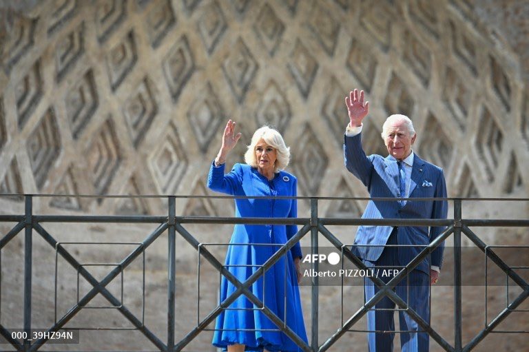 Britain's King Charles III and Queen Camilla greet the crowd in front of the Colosseum in Rome