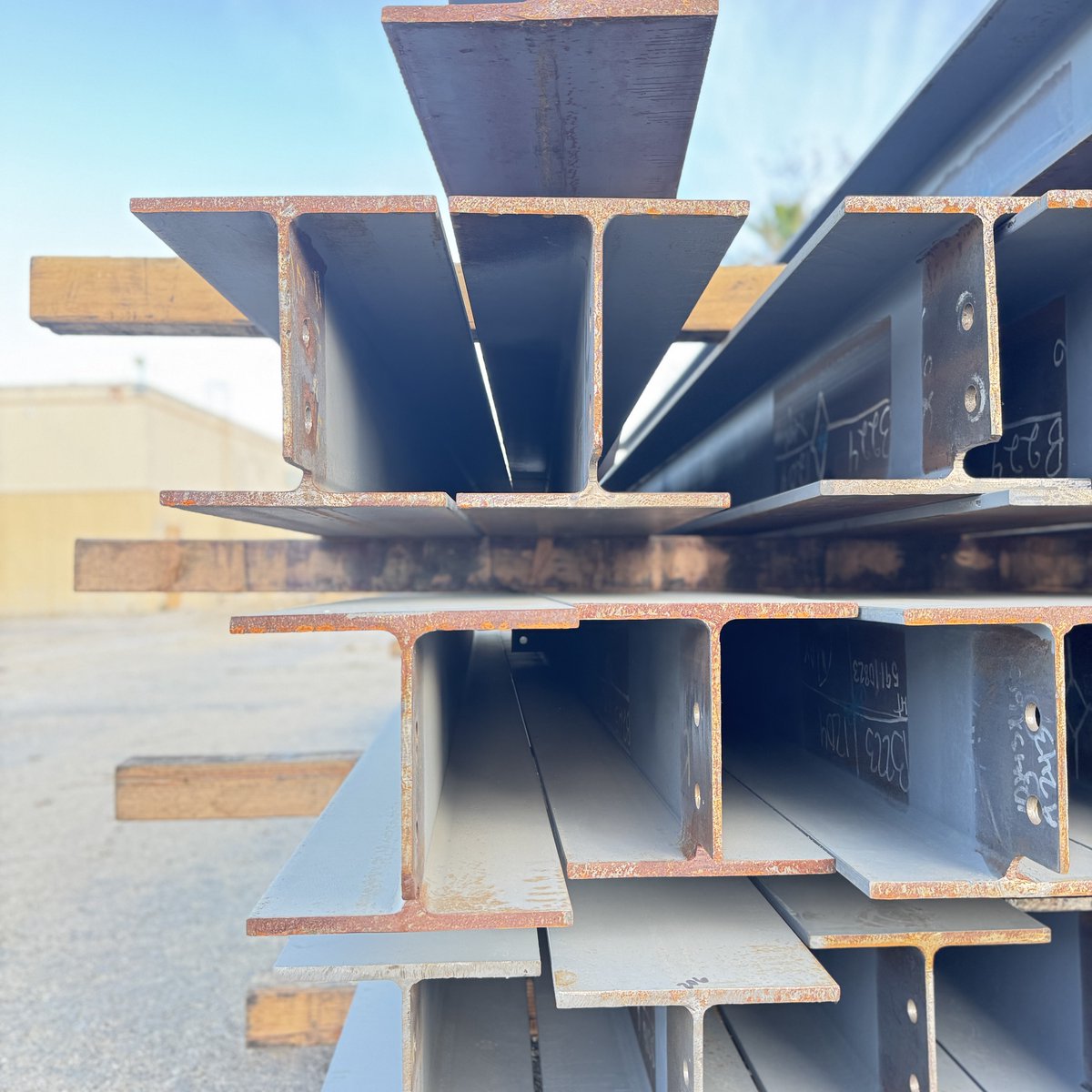 BorgesArch's tweet photo. Stacks of steel beams, rebar and spiral duct might seem like pure function, but look closer—there’s an art to construction. Lines intersect, shadows shift, and patterns emerge in the organized chaos of building. The materials themselves tell a story of transformation. https://t.co/p9u5xG2VTp
