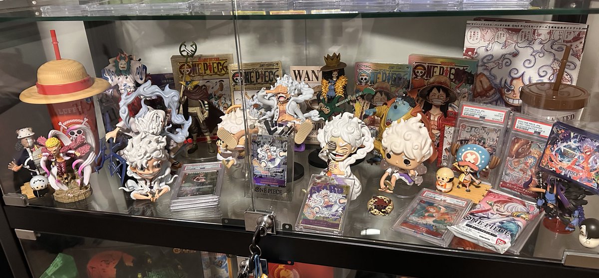 I haven’t opened any OP-11 since it released, cause I’ve been working on this instead ✨ here’s an inprogress look at my Gear 5 Luffy shelf! (Still need more figures and cards to display)

PS. Before anyone asks, that Manga Rare isn’t real, but it was a gift from a friend 🥹