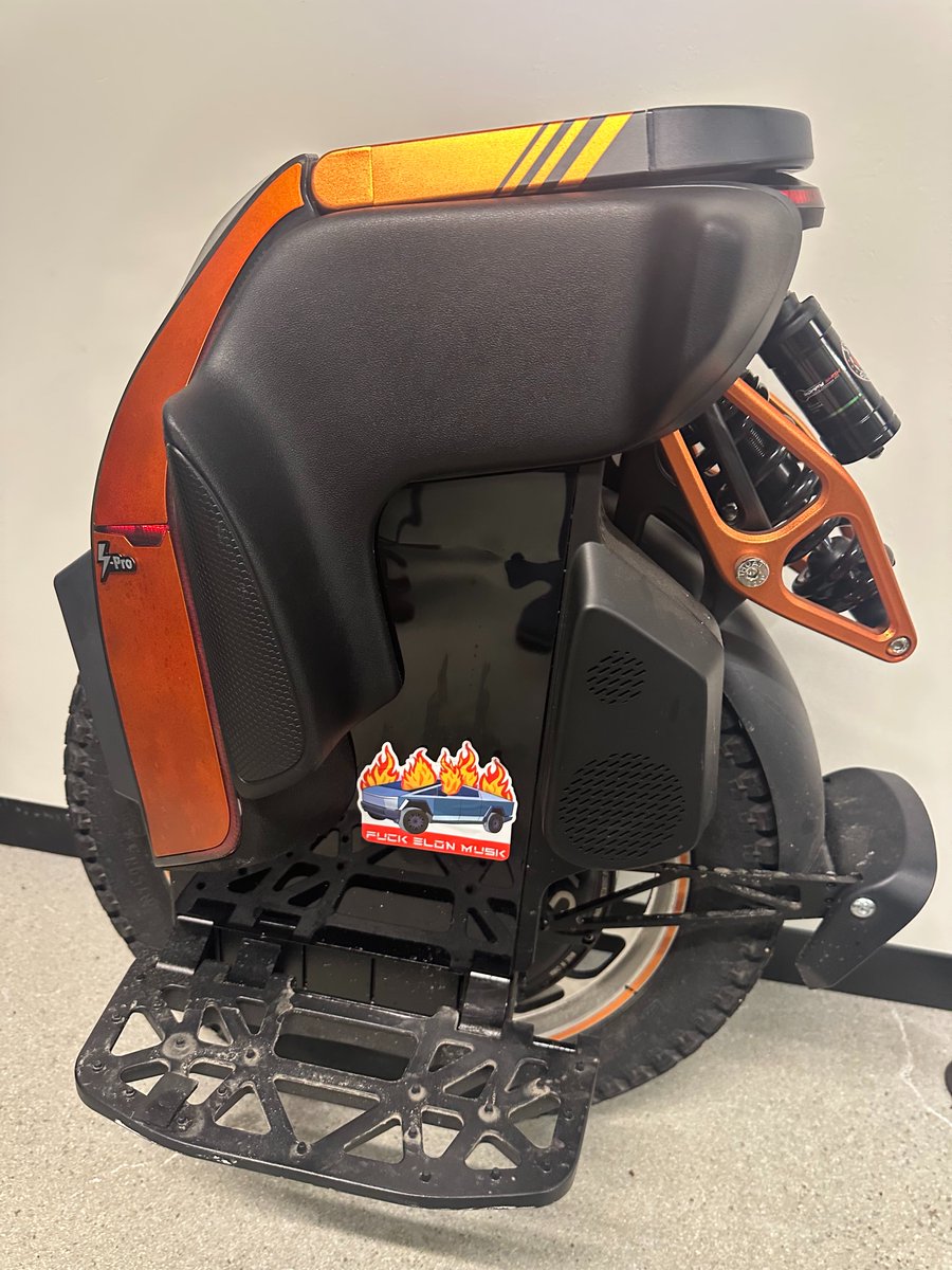 I discovered this lovely sticker on my Tesla about a week ago. It was parked as usual in my spot in the back alley between Storrow Drive and Beacon Street next to a bunch of trash cans and my Tesla charger (which had to be installed within a useless and unattractive container