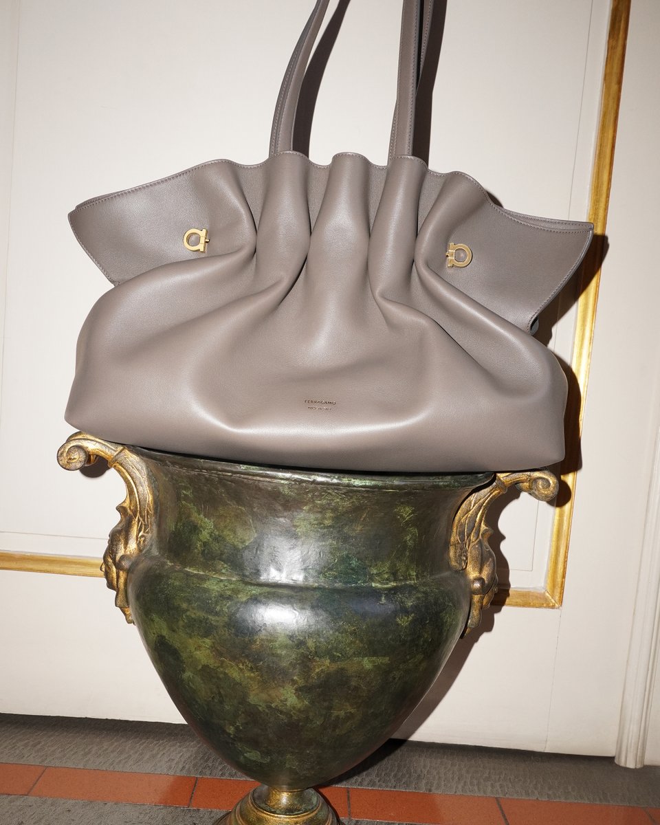 Ferragamo's tweet photo. Shapes and shades of Ferragamo's new Soft Bag. A reimagined archival design that pairs pleated curves in nappa leather or suede and piercing metal detail. The Soft Bag transforms from shoulder bag to pouch in a fold. 

https://t.co/sc7PcyGVot

 #FerragamoSS25 #FerragamoSoftBag https://t.co/HItZ9FlN0q