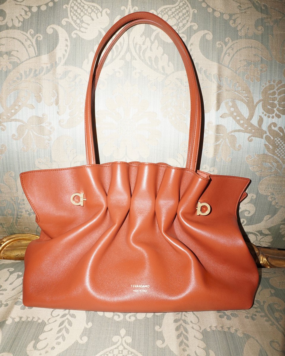 Ferragamo's tweet photo. Shapes and shades of Ferragamo's new Soft Bag. A reimagined archival design that pairs pleated curves in nappa leather or suede and piercing metal detail. The Soft Bag transforms from shoulder bag to pouch in a fold. 

https://t.co/sc7PcyGVot

 #FerragamoSS25 #FerragamoSoftBag https://t.co/HItZ9FlN0q