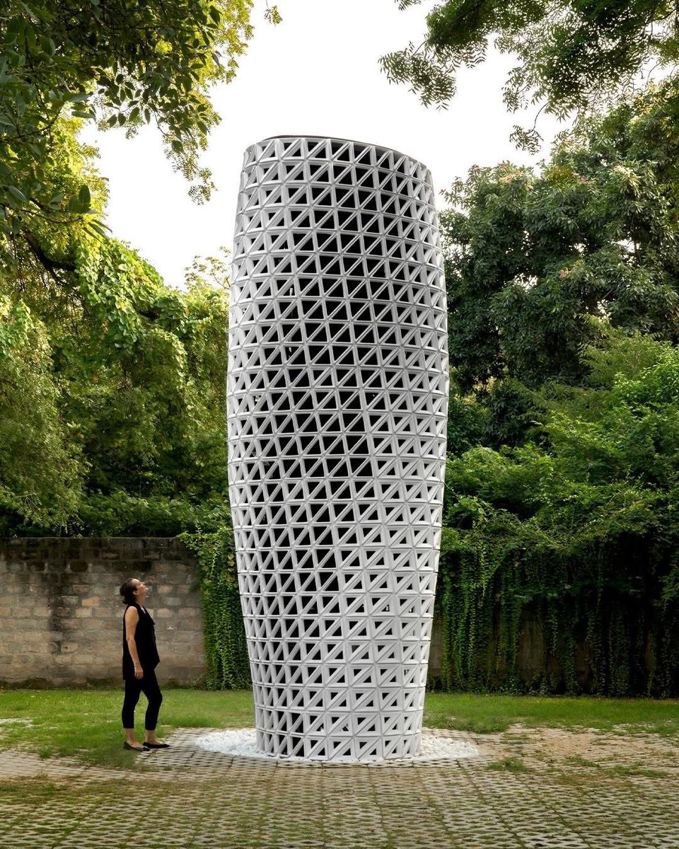 parametricarch's tweet photo. VERTO, created by Studio-Symbiosis Architects, is an air purification tower designed to maximize surface area, increase wind speed, and provide 360-degree air purification, located in New Delhi. The tower rotates as it rises and transforms polluted air into clean air, effectively improving the environment.

The triangular perforations are designed as a performance-driven system, with larger openings at the inlets and outlets. The ambient air is drawn in by energy-efficient fans and then filtered using fine dust filters to eliminate pollutants. An IoT control system allows for operation based on demand. 

📸 Avesh Gaur

#parametricarchitecture #parametricdesign #vertoair #sustainability #india