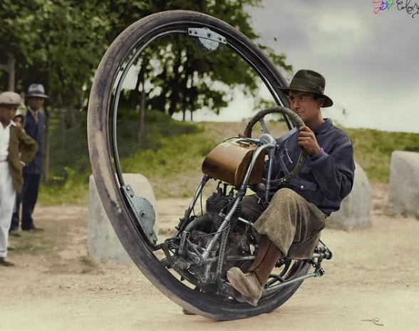 starside8's tweet photo. A man photographed riding a 1931 Cislaghi Motoruota monowheel vehicle on a dirt path in the Netherlands while people look on. Photograph taken in the 1930s. #HistoryInColor
@HistoryInPics https://t.co/zbwePo2D9m