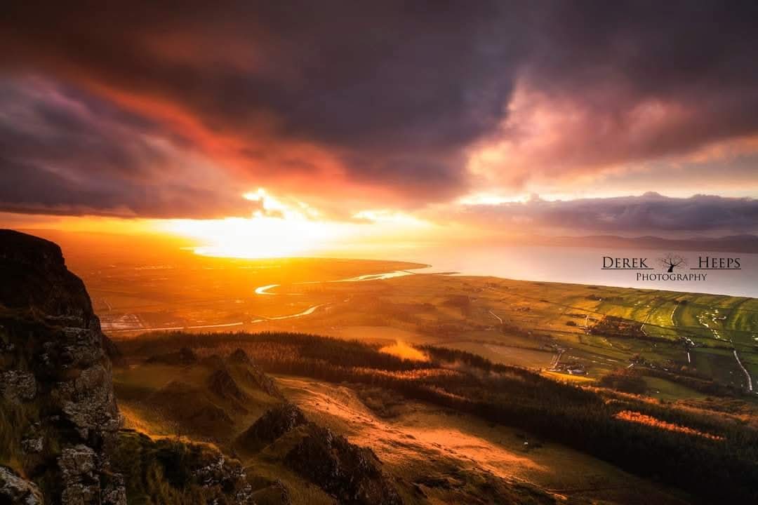 Dramatic light as the sun sets over the Roe Valley as seen from the top of Binevenagh! 

I love it when this sort of thing happens. The glory of mother nature!