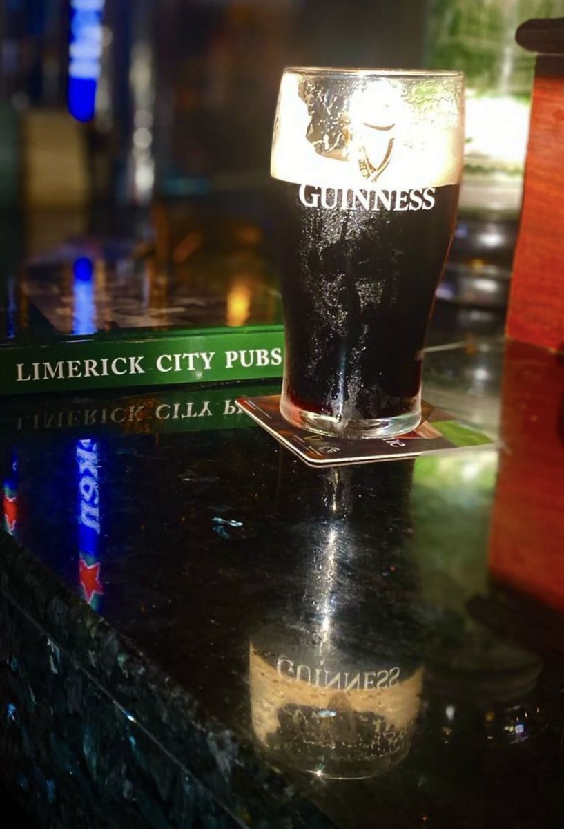 FearStairLmk's tweet photo. One of my favourite photos. Blazing sunlight, a perfect pint of #Guinness (@GuinnessIreland) and my pub book all perfectly placed in Timmy Martin’s Pub on Sarsfield Street, #Limerick @VFIpubs Photo credit: @mikehoare5 https://t.co/1lkzO7y69Y