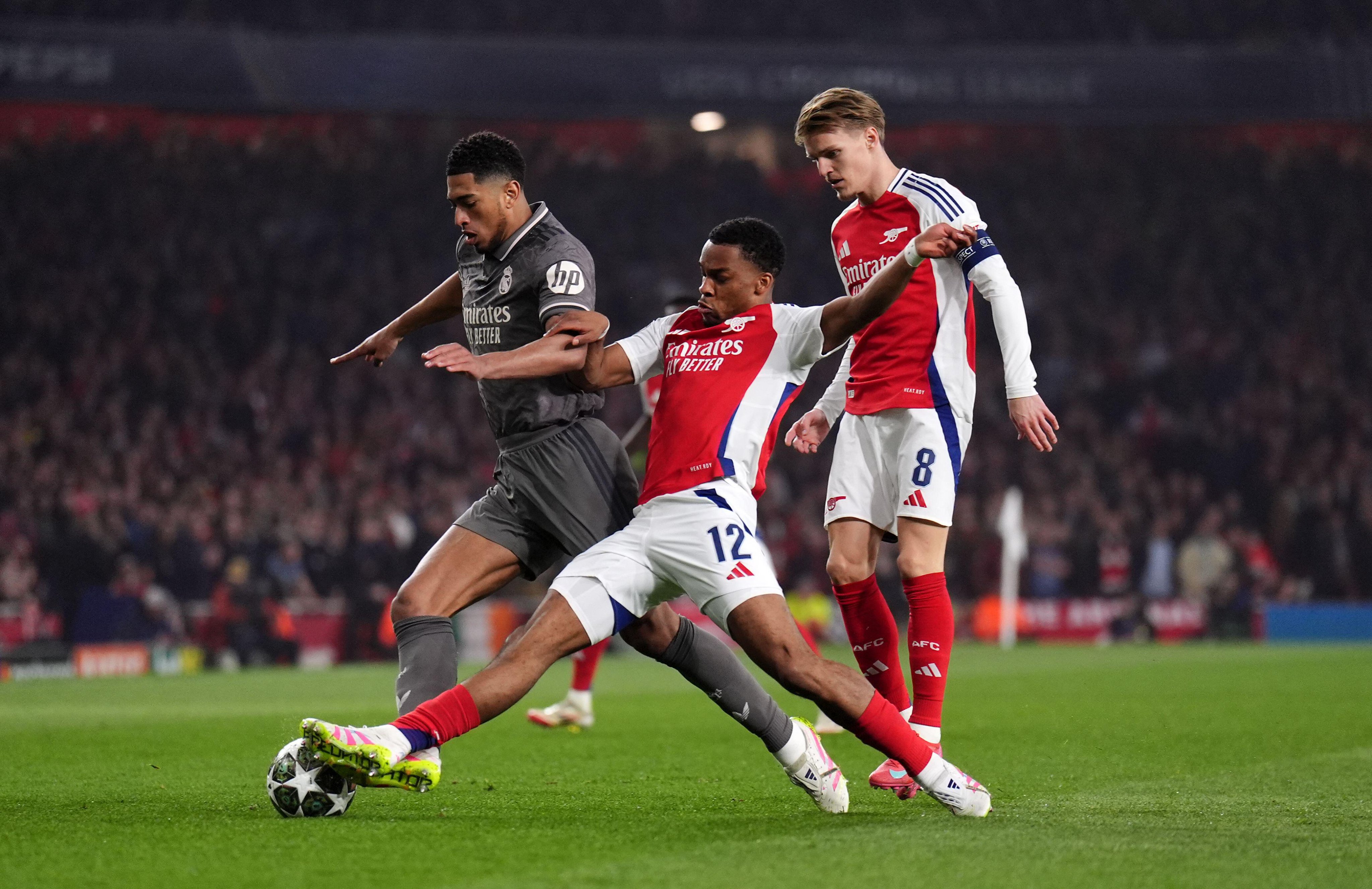 Jurrien Timber in action against Jude Bellingham - Arsenal vs Real Madrid UEFA Champions League 2024-25 quarter-final LIVE | sportzpoint.com