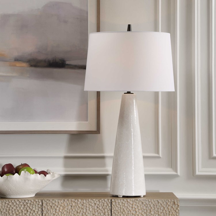 Simple yet versatile, this #carolynkinder ceramic table lamp features a cream-ivory drip glaze with subtle texture, accented with matte black details. In stock with fast, free shipping <a href="/De_Lighting/">Destination Lighting</a> at destinationlighting.com/item/the-utter… #uttermost