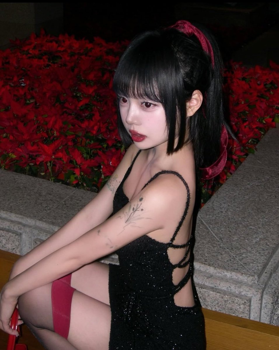 The room is on fire as she's fixing her hair.