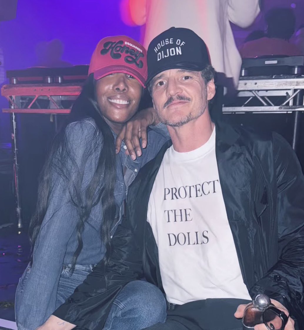 PopBase's tweet photo. Pedro Pascal pictured wearing a ‘Protect the Dolls’ T-Shirt at his 50th birthday party, alongside Honey Dijon.

All proceeds from the sales of the T-Shirt are donated to the Trans Lifeline charity. https://t.co/0eX9XsjxYp