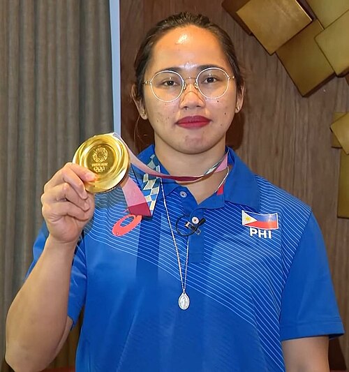 WH31gh7s's tweet photo. Hidilyn Diaz
Olympic Gold Medalist
History-maker! Hidilyn Diaz lifted the spirit of an entire nation—literally—by winning the Philippines’ first-ever Olympic gold medal. #WomensMonth #StrongPinay https://t.co/Rge79UnITD