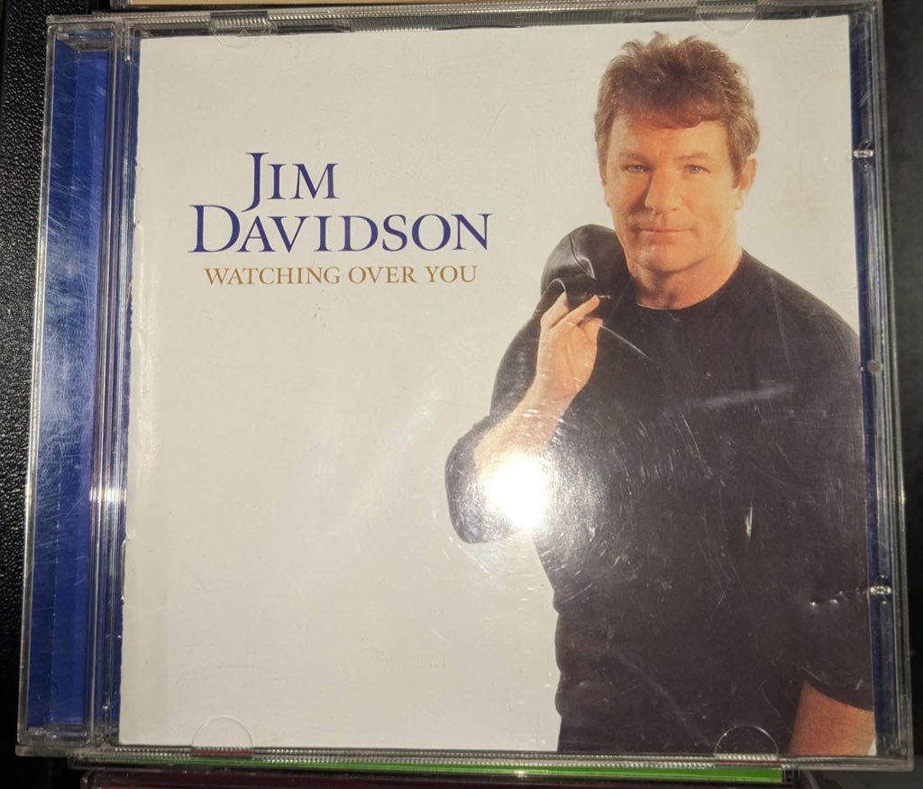 I see you’re wearing a Jim Davidson t-shirt.
Ok, tell me the running order track by track for Watching Over You.