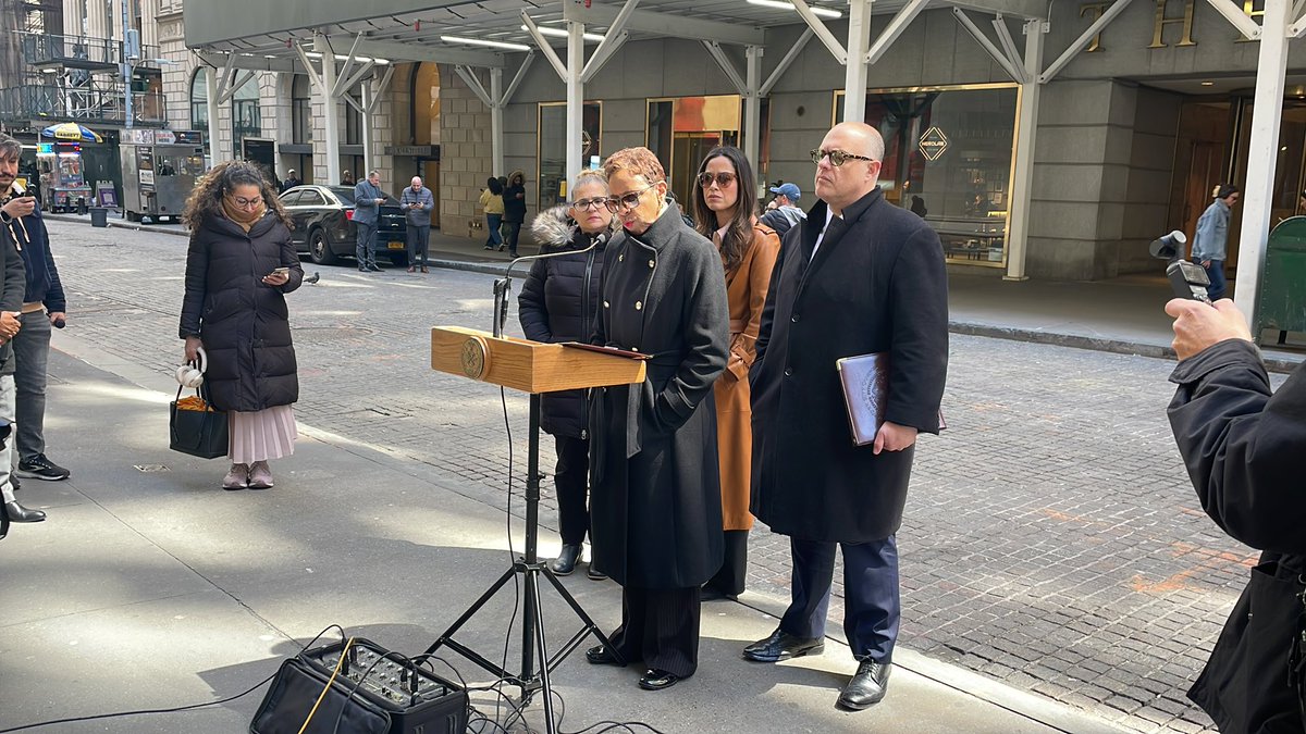 Speaker Adrienne Adams and Councilmember Justin Brannan giving an address in front of Trump Building on Wall St about tariffs effect on the city