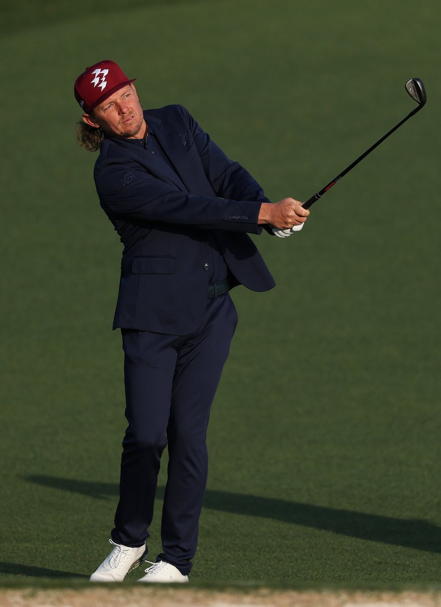 Cam Smith is wearing a suit jacket to warm up at the Masters today.