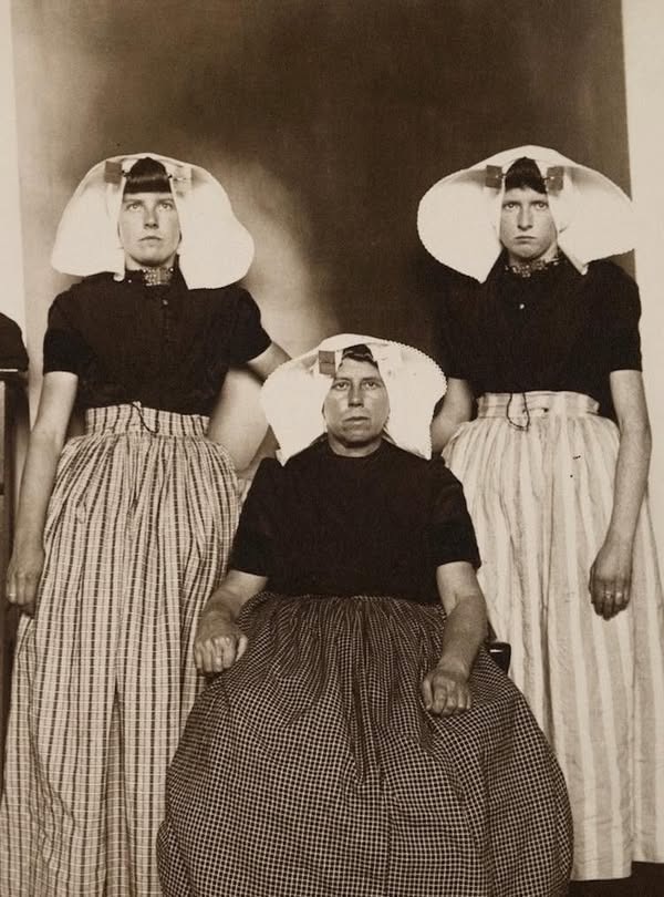 We are told these are "Three Dutch Women, circa 1910". Forensics not required for this one. Those man knuckles must drag on the floor when they walk 🦍