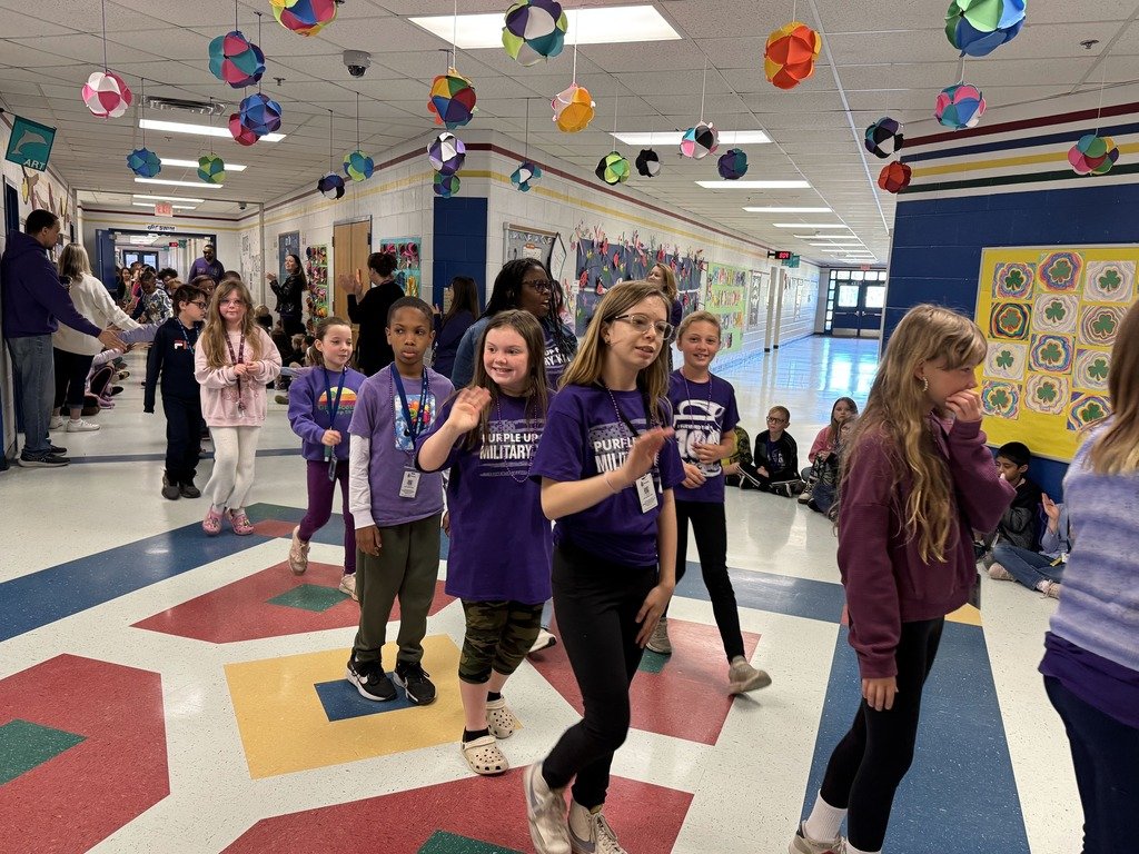 CRE Appreciating all our Military Students this week!!  Today is our PURPLE UP Parade, and CRE Dolphins show their support with waves and smiles!!