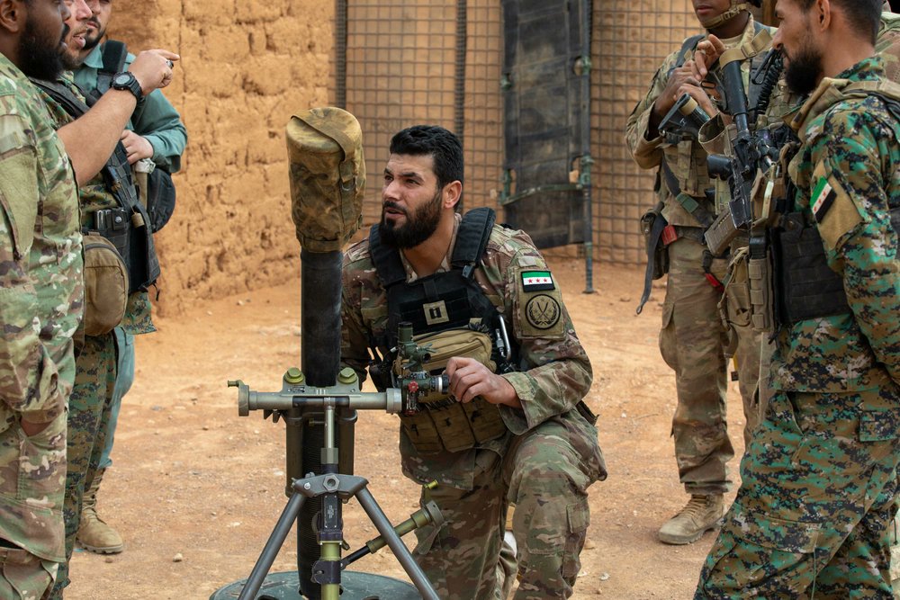 CJTFOIR's tweet image. Set position, take aim, and fire with confidence.

Syrian partner forces and @10MTNDIV Soldiers train on and construct a mortar position during a patrol in the Deconfliction Zone, Syria. 

@CENTCOM @usarmycentral @SyrianFree_Army 
#CJTFOIR #Coalition #SFA #SyrianFreeArmy #Mortar