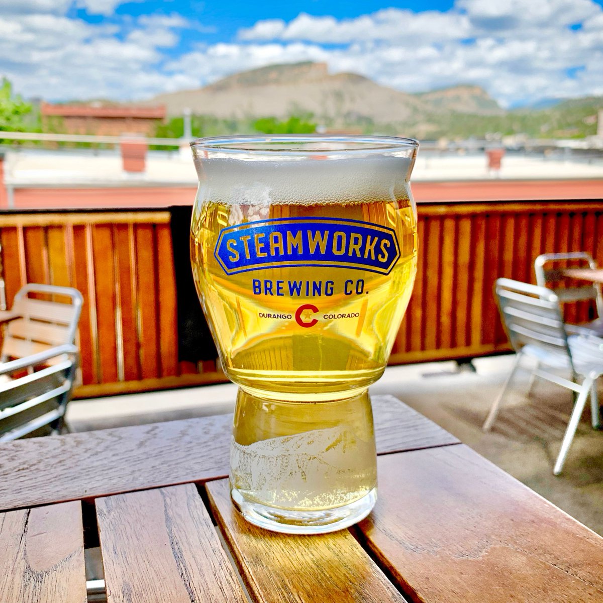Stmworks's tweet photo. Who's ready for patio season? Because this view—and this pint—aren’t going to enjoy themselves. 🍻⛰️ #DurangoColorado #PatioSeason #CraftBeerLife #BeerViews  #ColoradoBeer #DrinkLocal #BreweryVibes https://t.co/0OV8XGMTV7