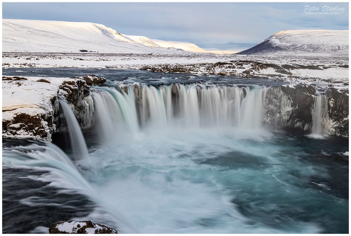 Peter__Starling's tweet photo. The ever-changing winter light of Goðafoss Waterfall, from the golden early-morning light picking out the amazing ice formations to the beautiful blue-hour just before darkness.
One of my favourite places in the world!

#Iceland #Godafoss #waterfall #photography https://t.co/gVQ470pKwd