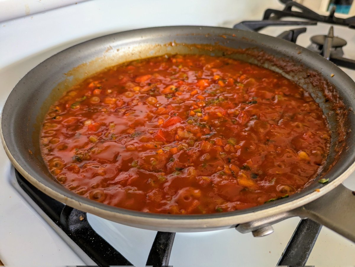 Fresh from the market Cod poached in a presto pan ragout and served over spaghetti rigatti.  A delightful and quick meal for a Wednesday.