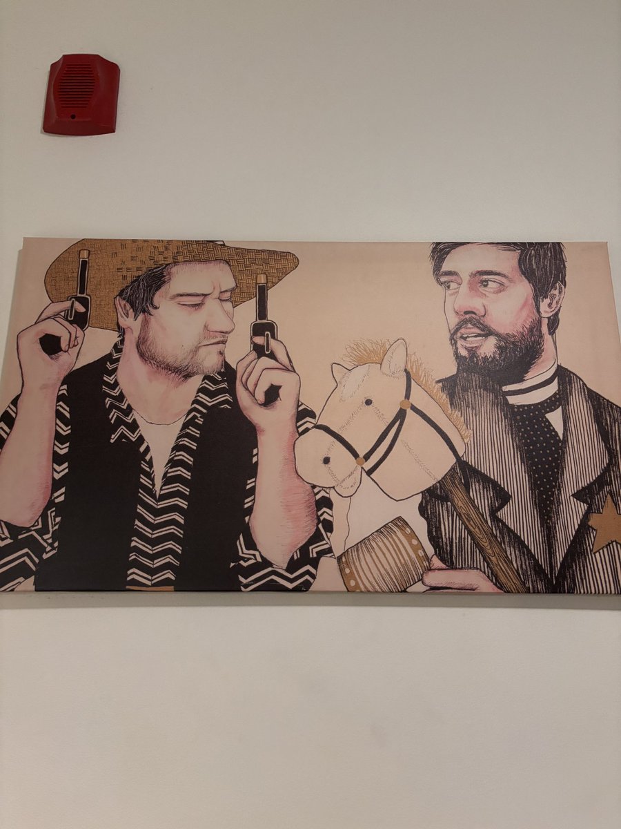 Am I drunk or does this look like a drawing of <a href="/ZachHalverson/">Zach Halverson</a> holding two pistols next to Aaron Rodgers holding a hobby horse?