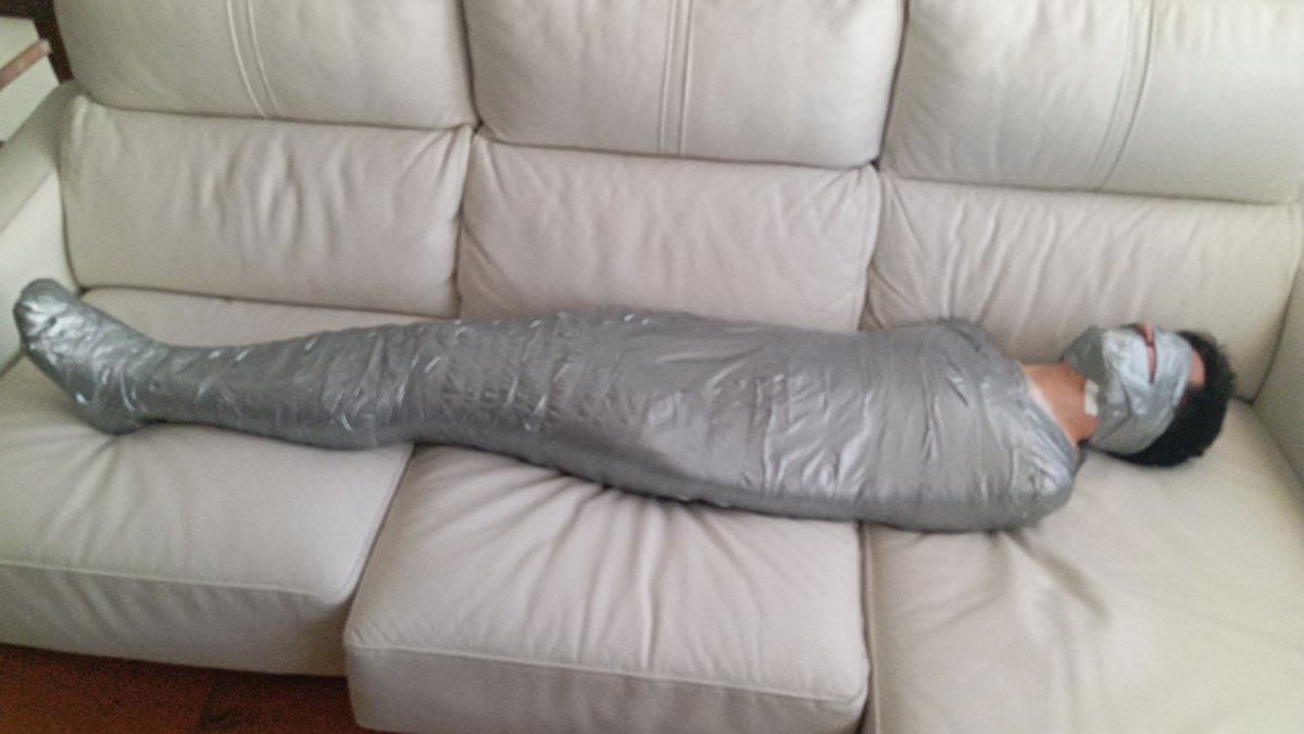 TapeMouthArg's tweet photo. In my last trip I told my new friend that I liked duct tape so he made me spend the whole night mummified and struggling #bondage #bound #mummy https://t.co/qIiNzCH9xs