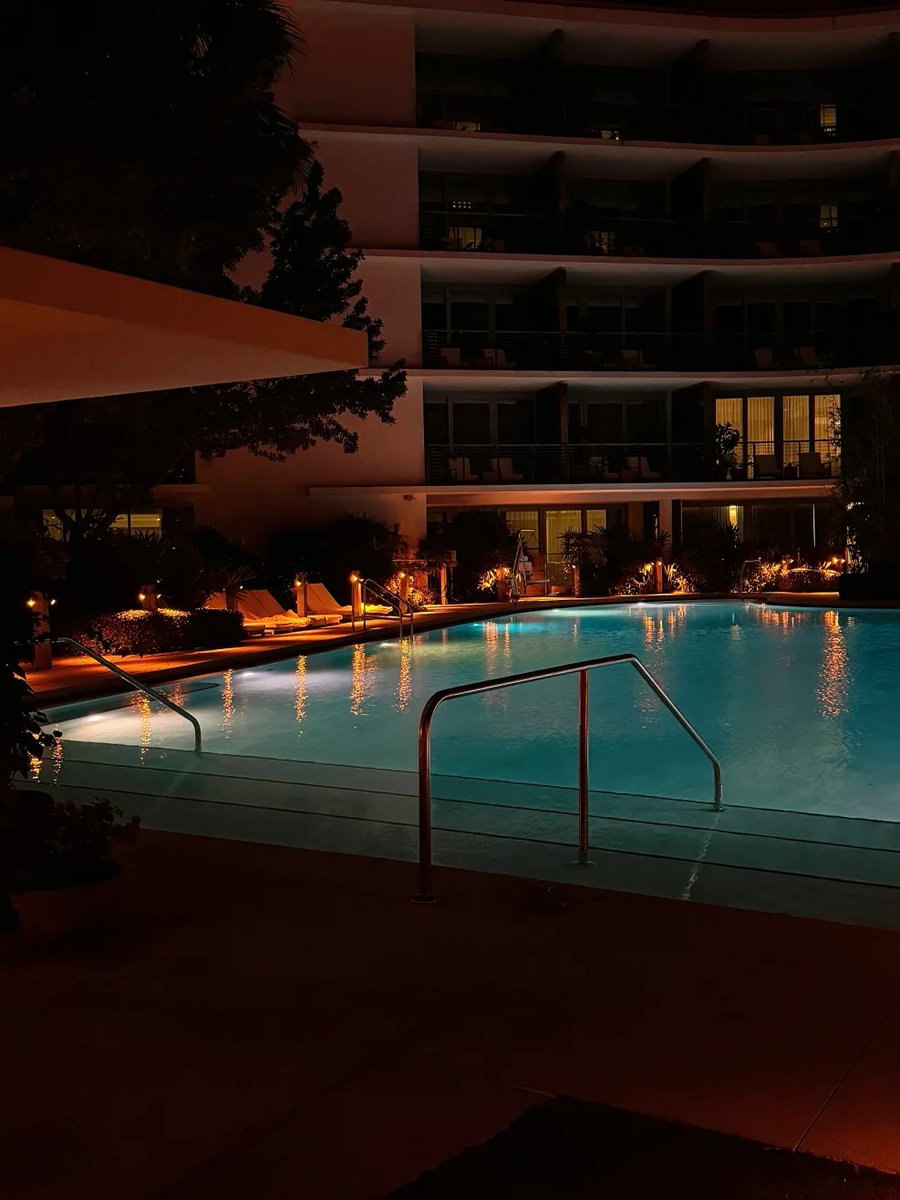 As night falls, the swimming pool emits a quiet light, as if telling a secret story, opening its arms to welcome every soul that doesn't want to fall asleep.