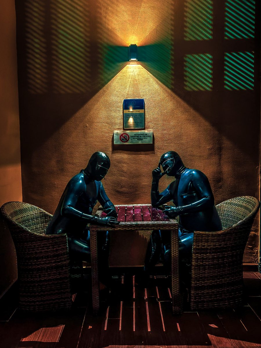 SEEING DOUBLE

The rubber gimp sat alone at a small poolside table, the wet latex of his suit creaking softly as he leaned forward. Across from him, identical in every way, sat... himself. 

Inspired by <a href="/iambyakko/">Byakko白虎</a>
📸 <a href="/saint803/">saint80</a>
🧥 <a href="/mrlatexchina/">泡泡</a>