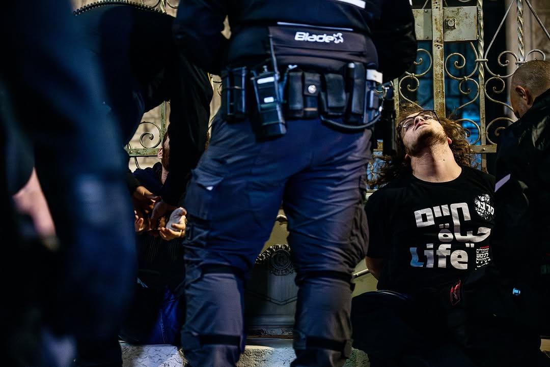 itamar_green's tweet photo. I was arrested yesterday *again* by Israeli police - for protesting against the genocide.

They’re trying to hide the murder. Hide the blood. Hide the Palestinians - like they’re not human.

It won’t work.

Refuse. Resist.
Fight for justice✌️

Picture: @mostafalkharouf https://t.co/IKGXFeYxmv