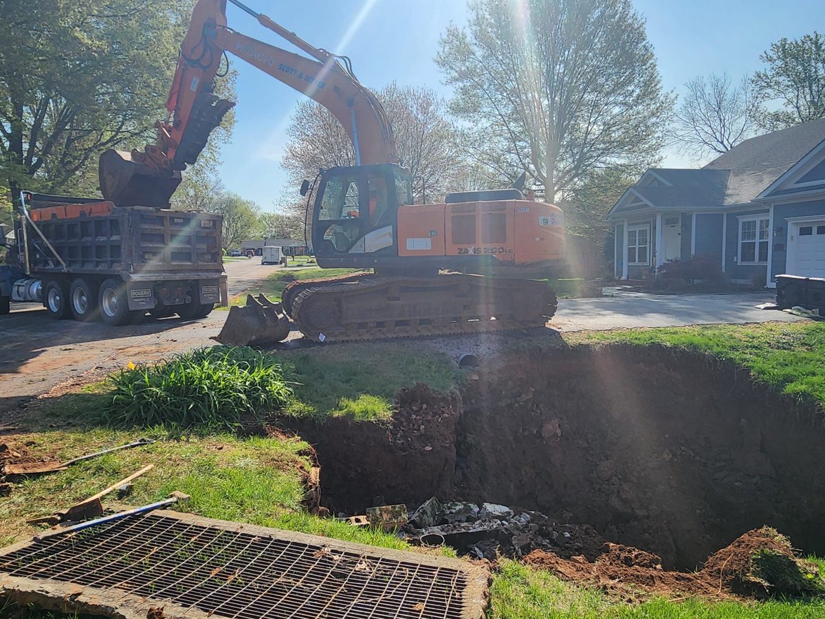 CityofBGKY's tweet photo. Normandy Way Sinkhole repair is underway. We are working hard to make infrastructure repairs following the flood. https://t.co/4rJr2v97eh