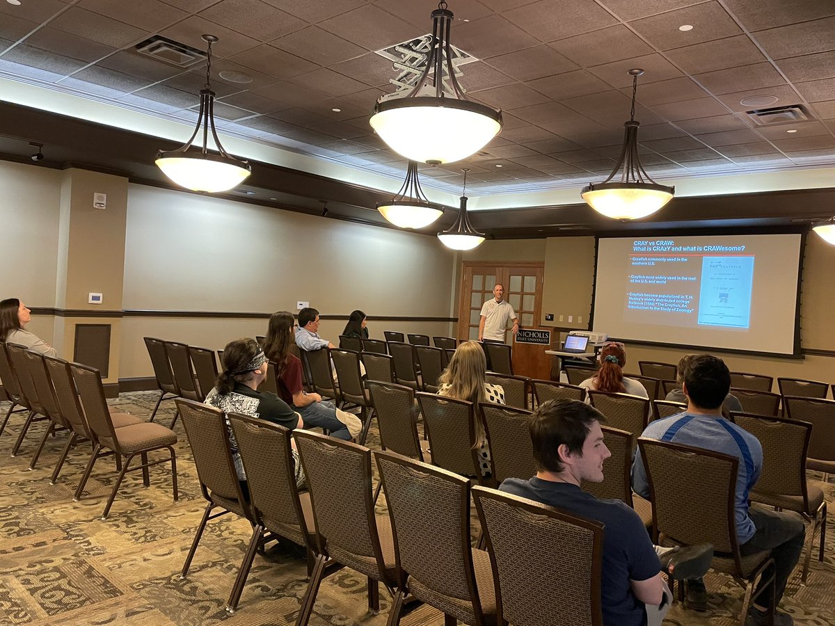 NichollsUGS's tweet photo. Dr. Chris Bonvillain breaks it down at the annual #CrawfishDay lecture—exploring what makes Louisiana’s red swamp crawfish so CRAWesome! 🦞
#NichollsGSAW #NichollsUGS https://t.co/oYtyBpAQvj