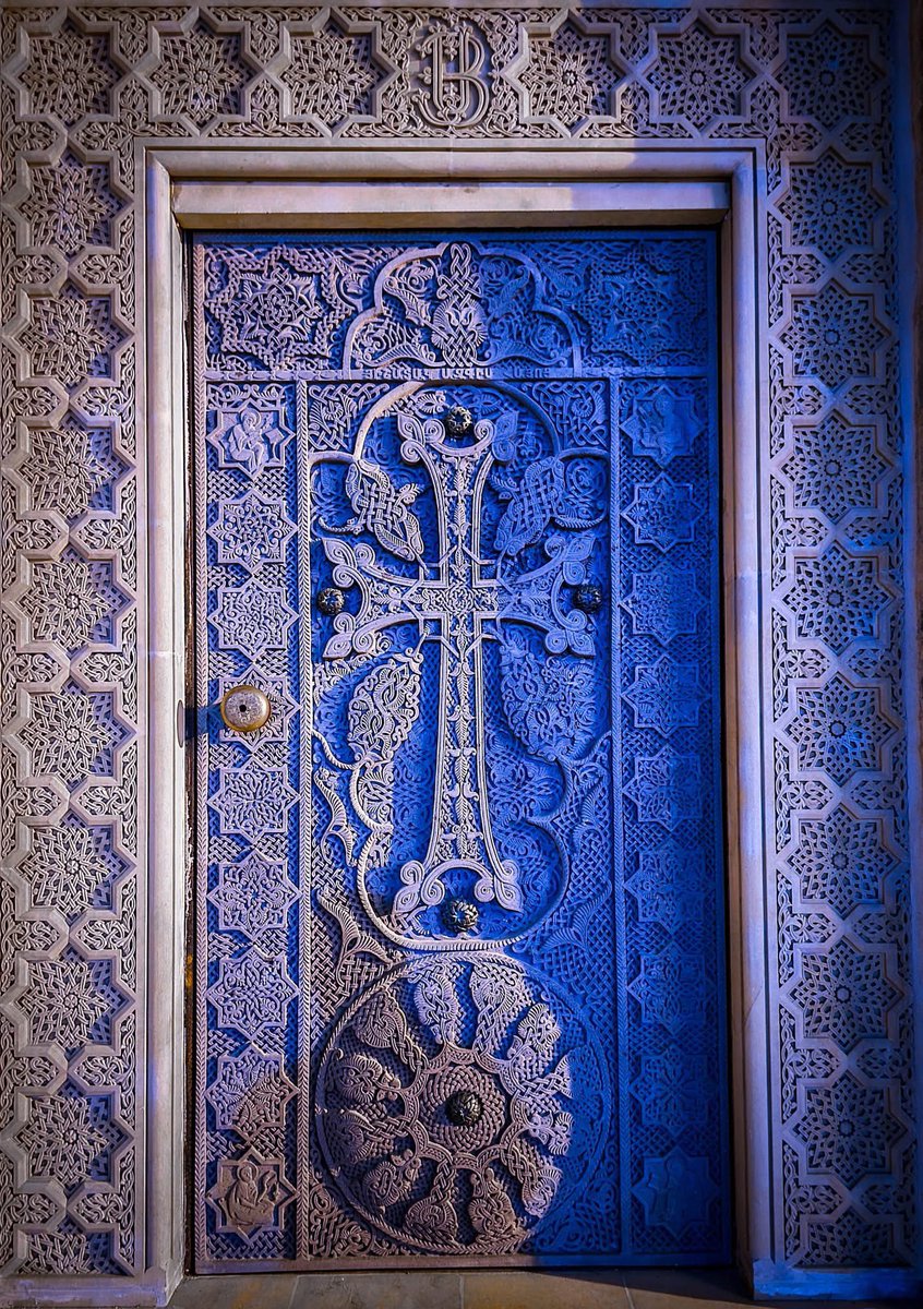 The Khachkar (Armenian cross-stone) entrance to the St. Hovhannes (John) Chapel, adjacent to the Church of the Holy Sepulchre in Jerusalem.

Made in the town of Abovyan, Armenia. At the top are the intertwined armenian letters "Ս" (S) and "Յ" (H), which form the official seal of